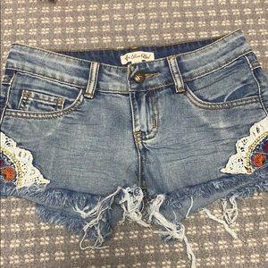 Flower embroidered jean shorts